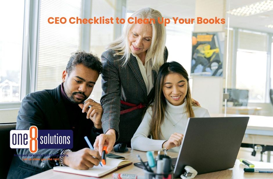 group of three people looking at paperwork