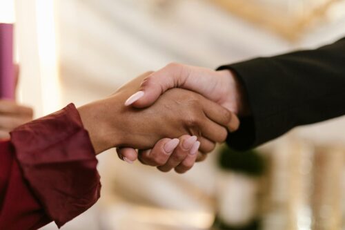 man and woman shaking hands