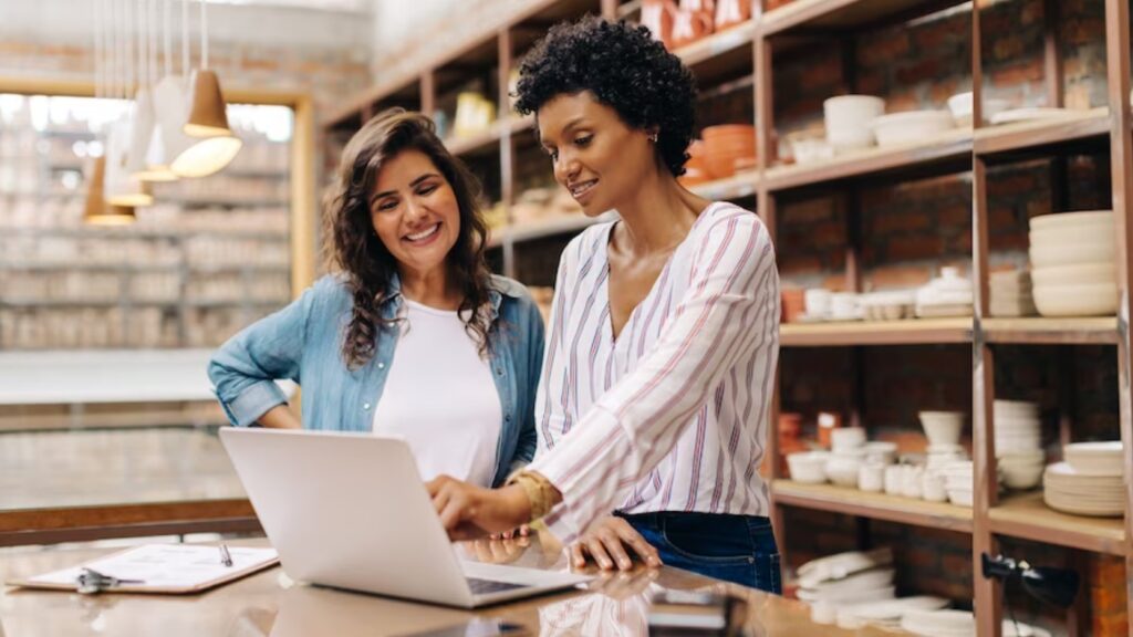 two women at a laptop