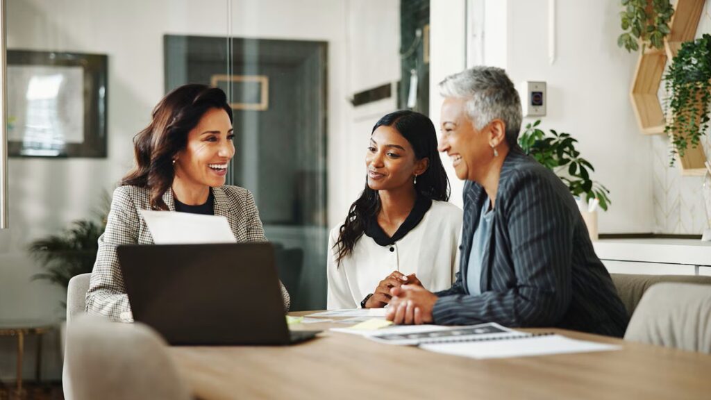 three people sitting at a table