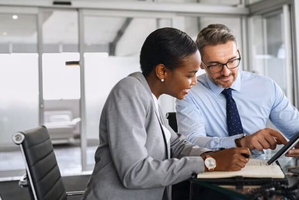man and women sitting a table